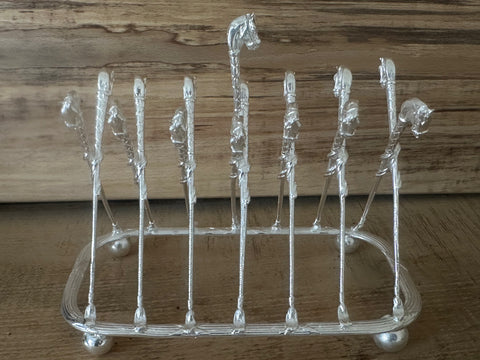 Horse head and whip toast rack
